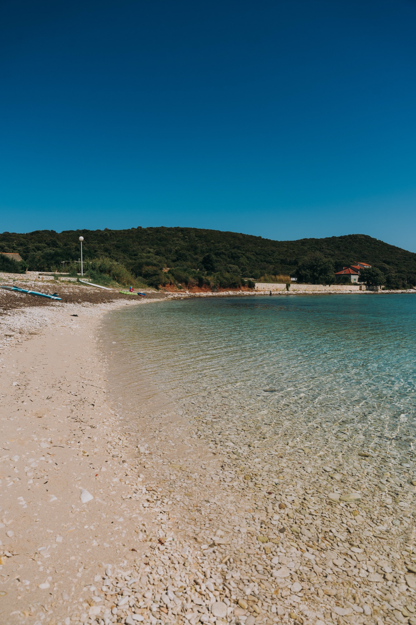 Beach and coastline of Premuda, portrait view