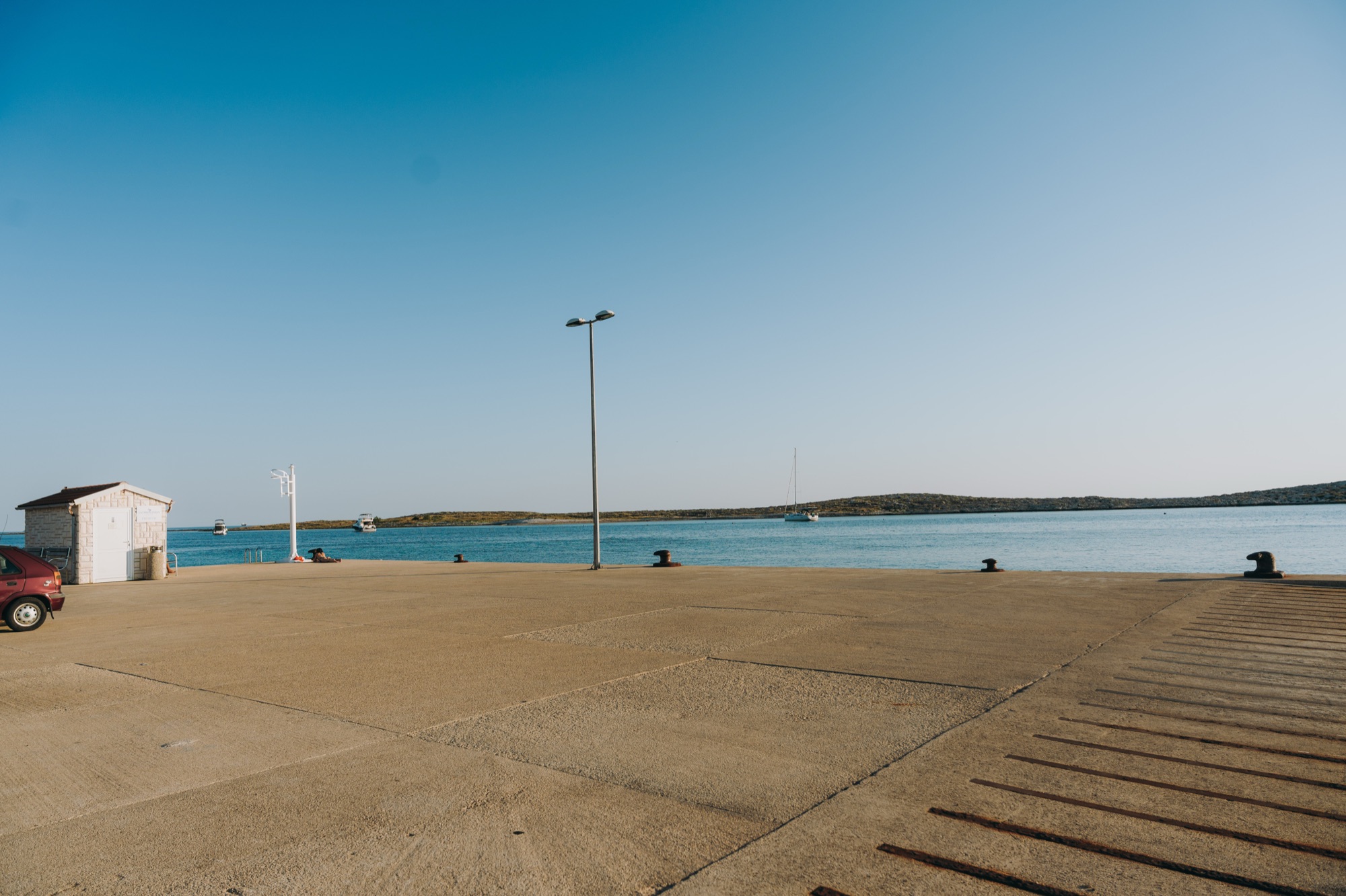 The empty ferry pier at Premuda looking out to sea